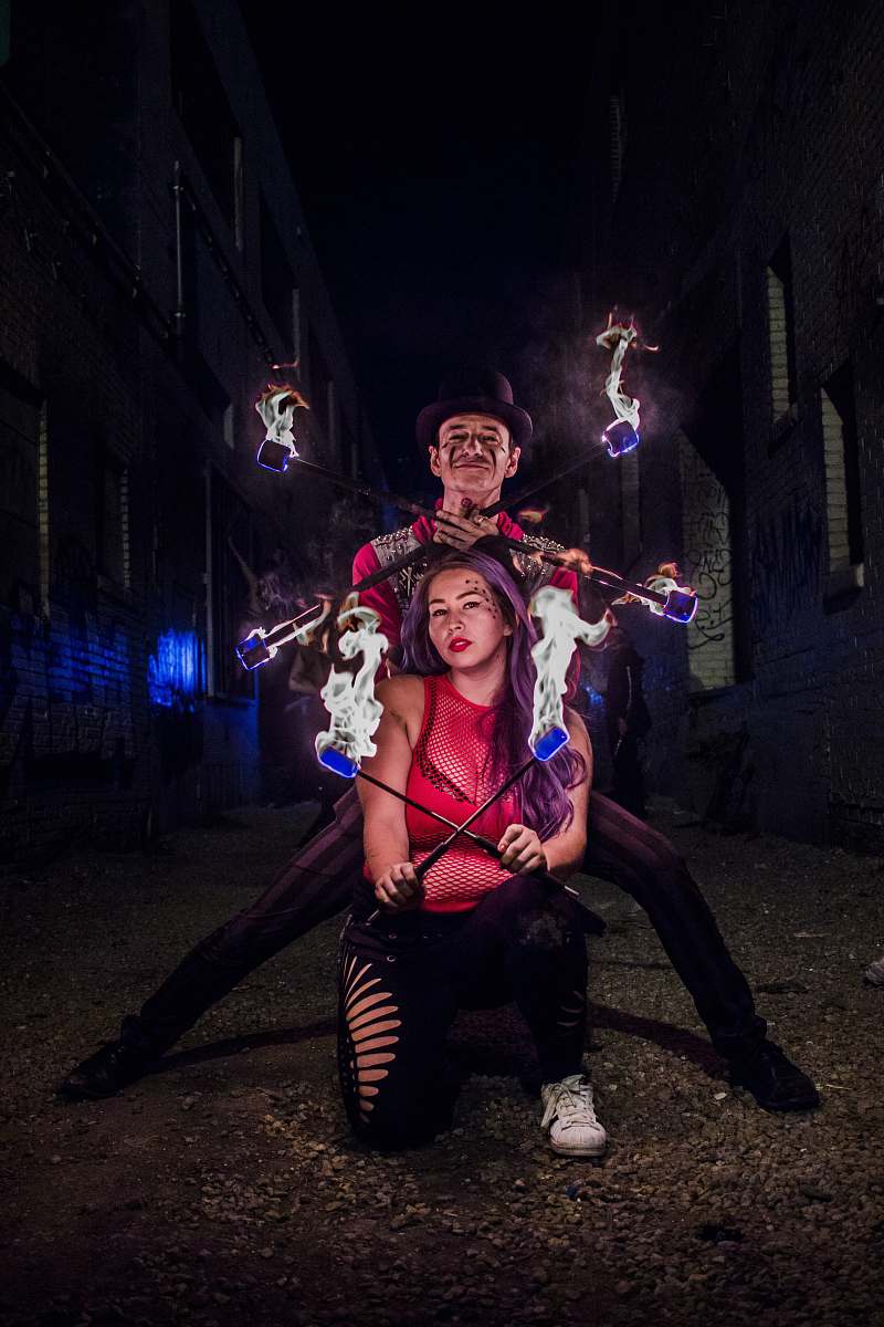 leisure activities woman and man holding stick with fire during night time human